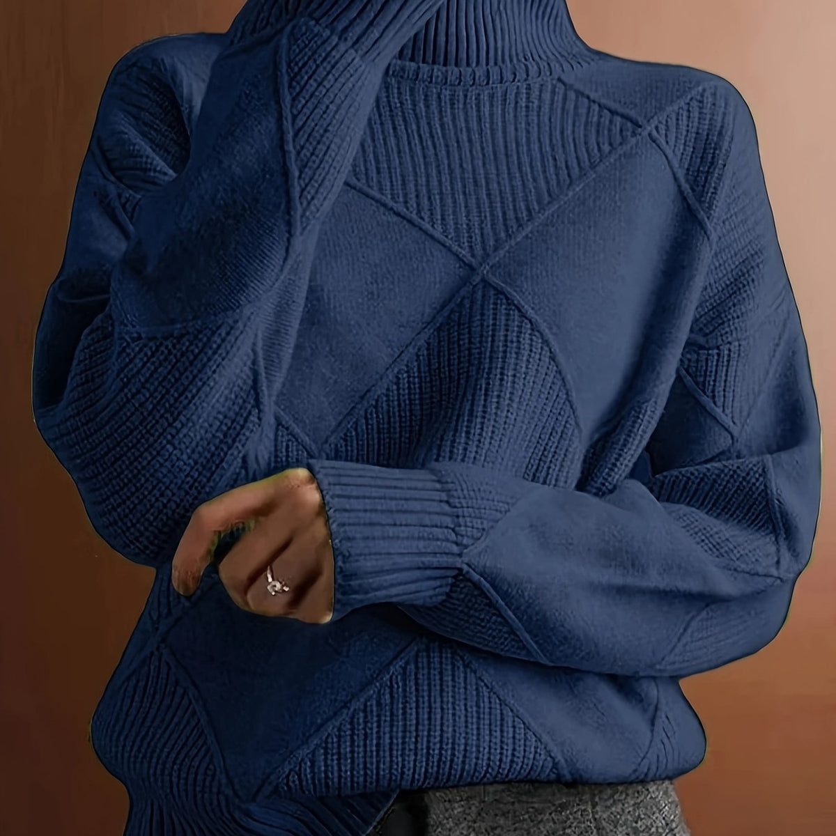 Women's textured knit turtleneck sweater with a relaxed, roomy fit