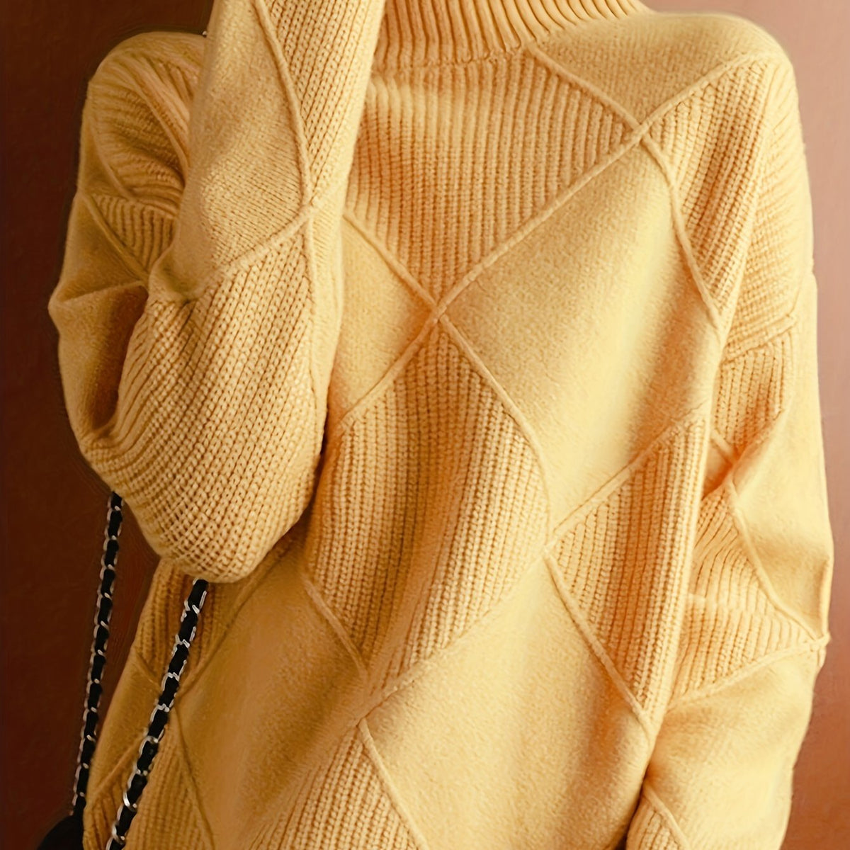 Women's textured knit turtleneck sweater with a relaxed, roomy fit