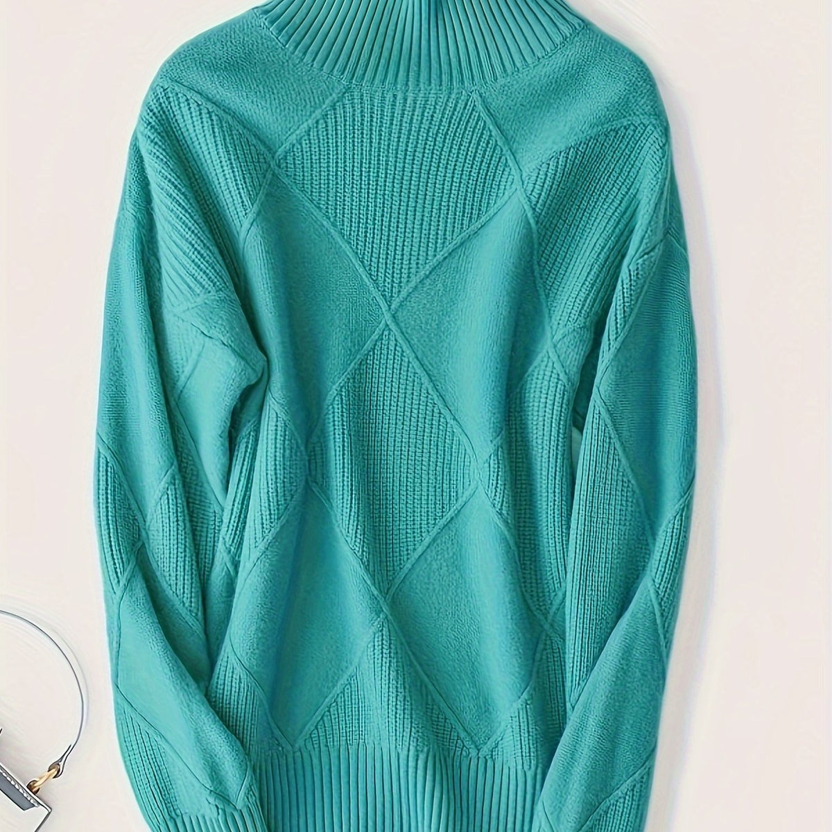 Women's textured knit turtleneck sweater with a relaxed, roomy fit