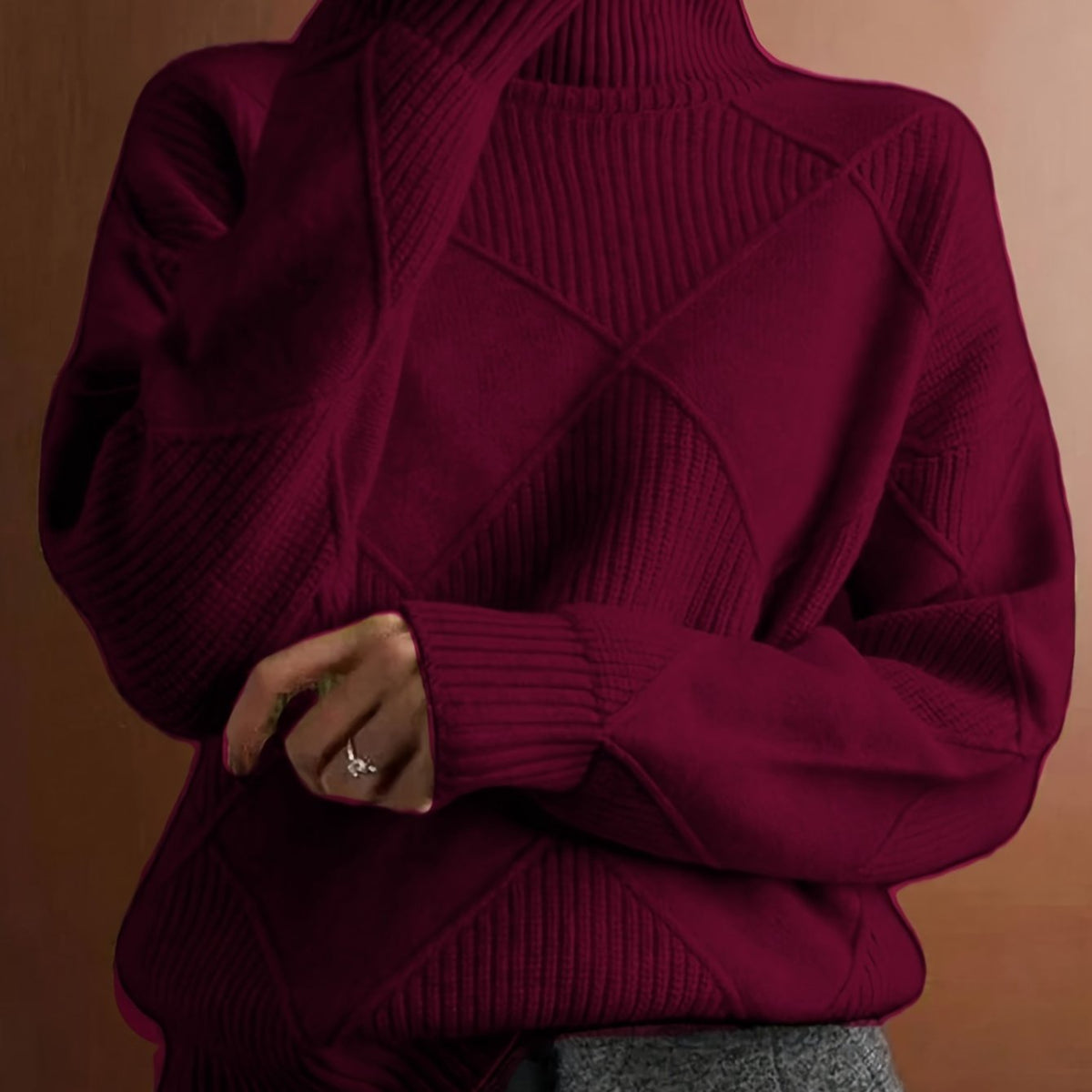 Women's textured knit turtleneck sweater with a relaxed, roomy fit