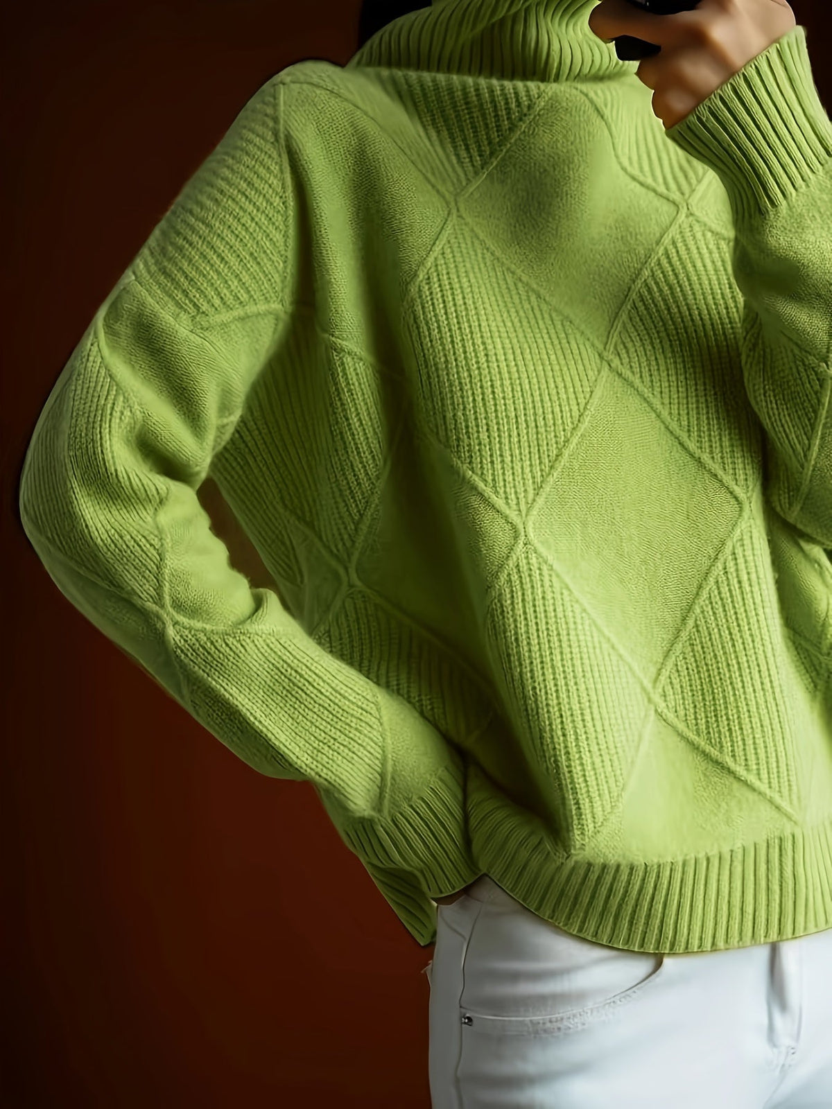 Women's textured knit turtleneck sweater with a relaxed, roomy fit