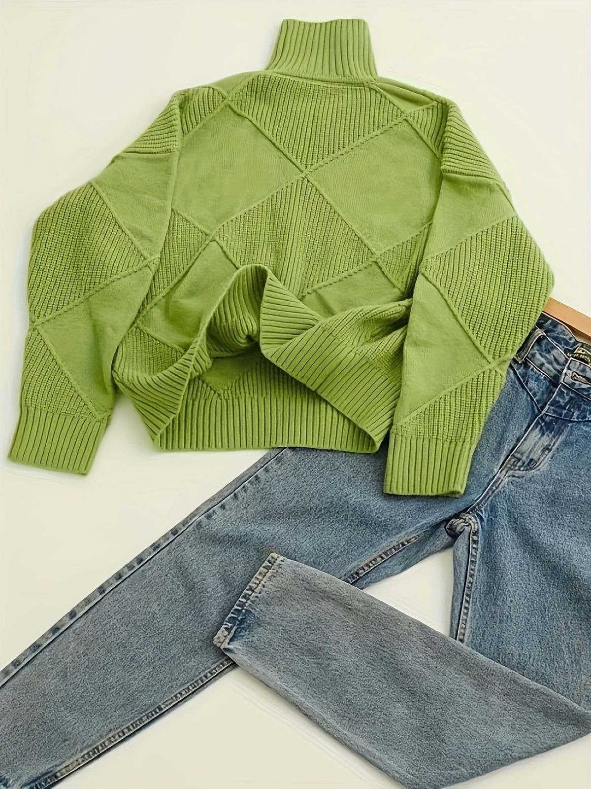 Women's textured knit turtleneck sweater with a relaxed, roomy fit