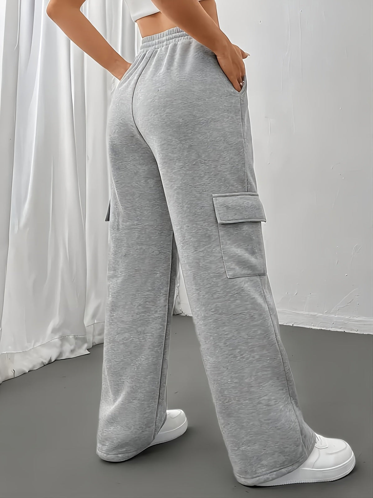 Women's gray fleece cargo joggers, back view with side pocket
