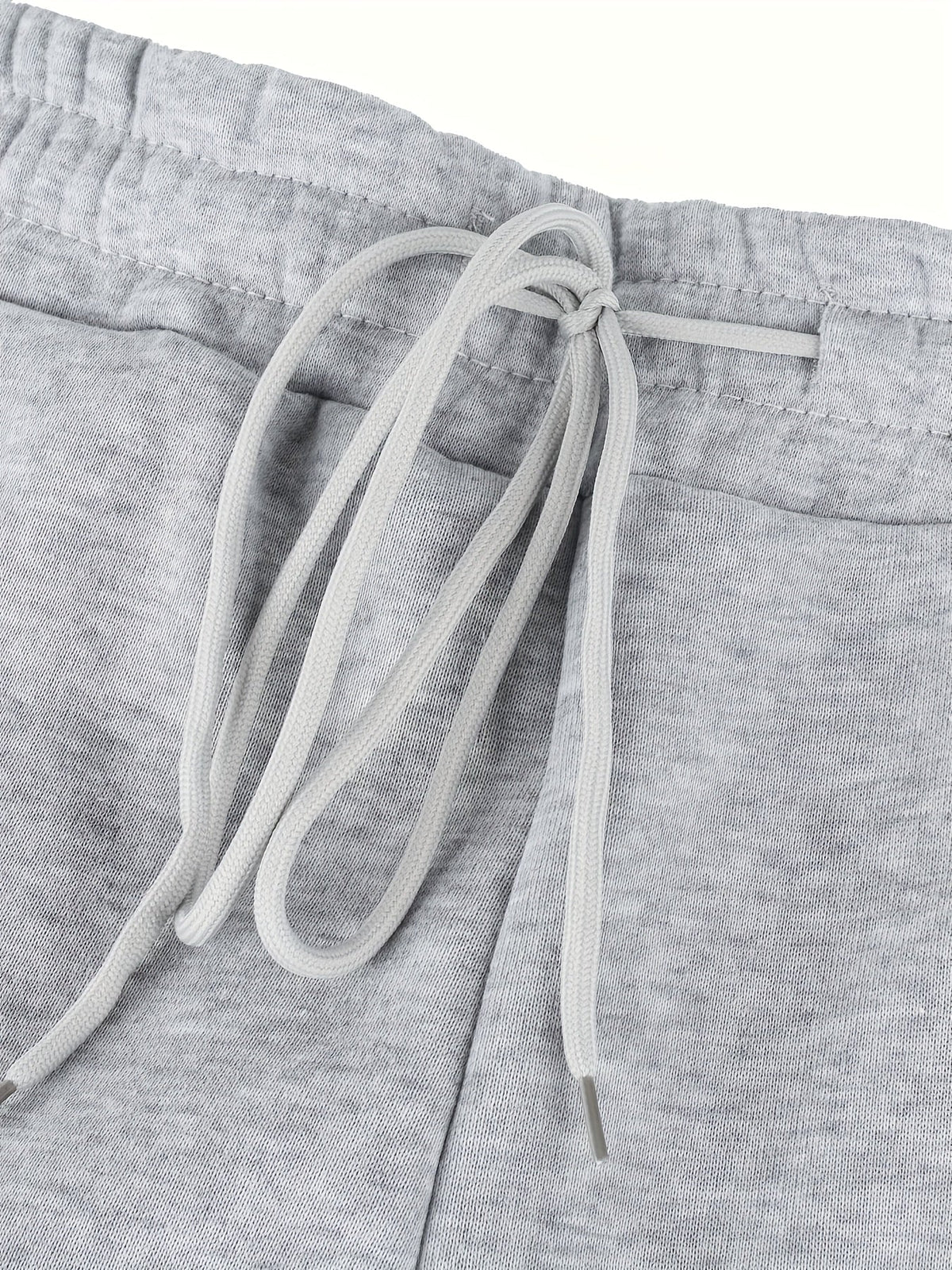 Women's gray fleece jogger pants, drawstring waist close-up