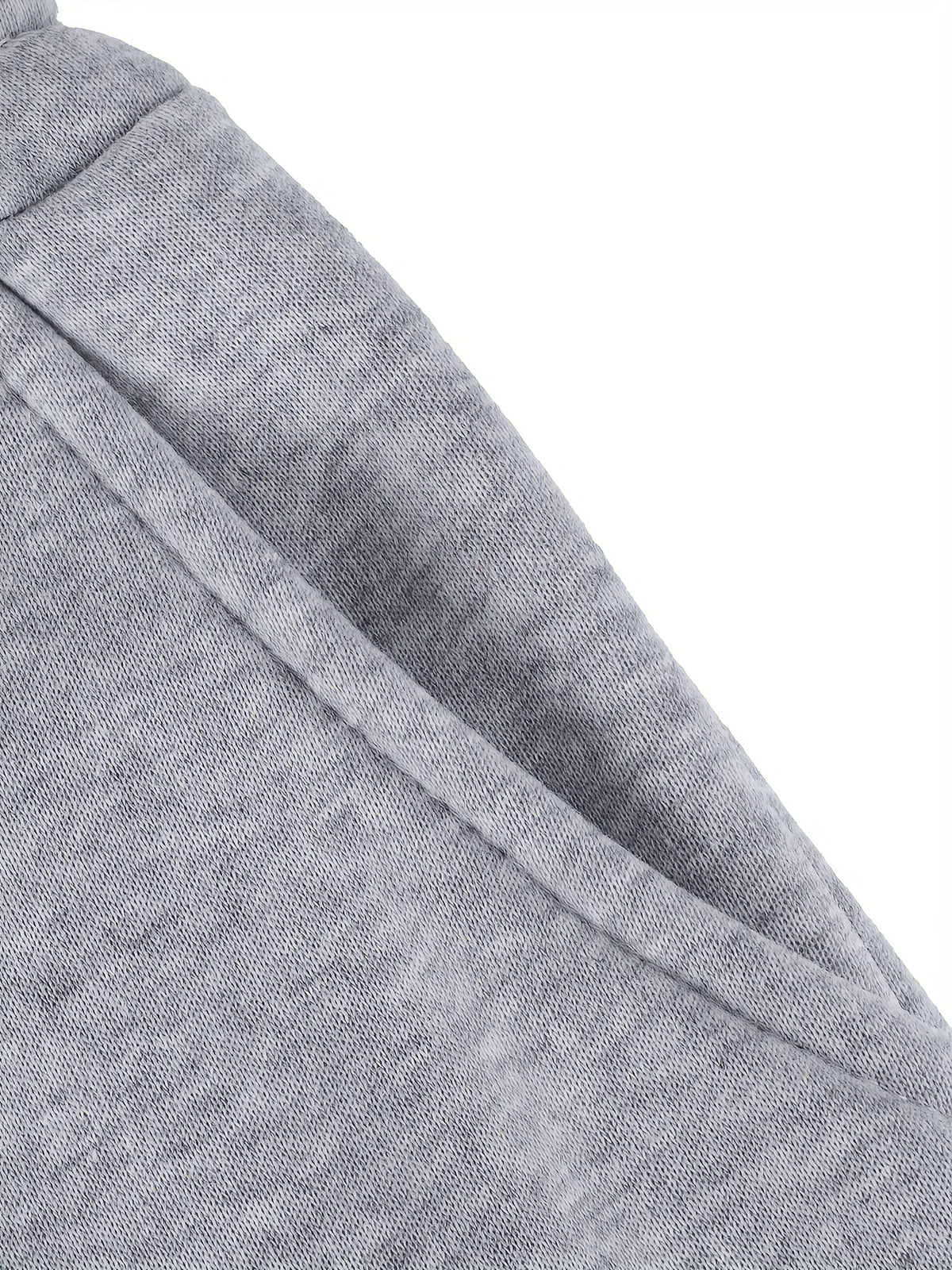 Women's gray fleece jogger pants, fabric and seam close-up view