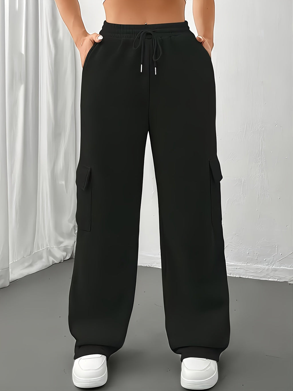 Women's black fleece cargo joggers with adjustable drawstring waist