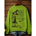 Women's green Halloween crewneck sweatshirt with witch graphic print