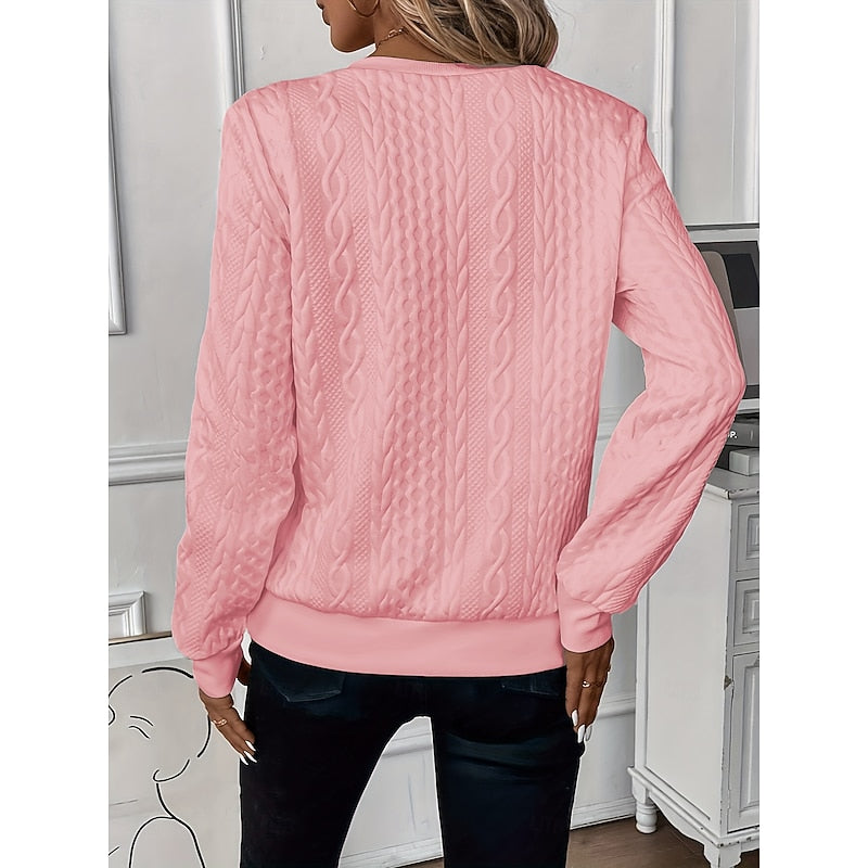 Back view of the cable-knit quarter-zip pullover's ribbed hem