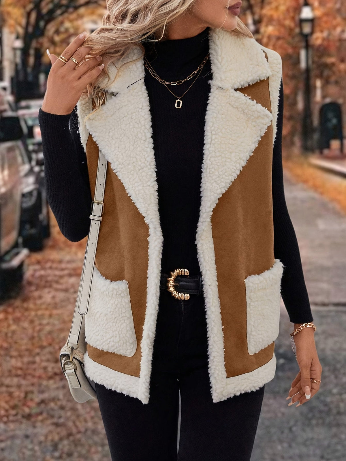 Women's rust sherpa lapel vest with open front and pockets