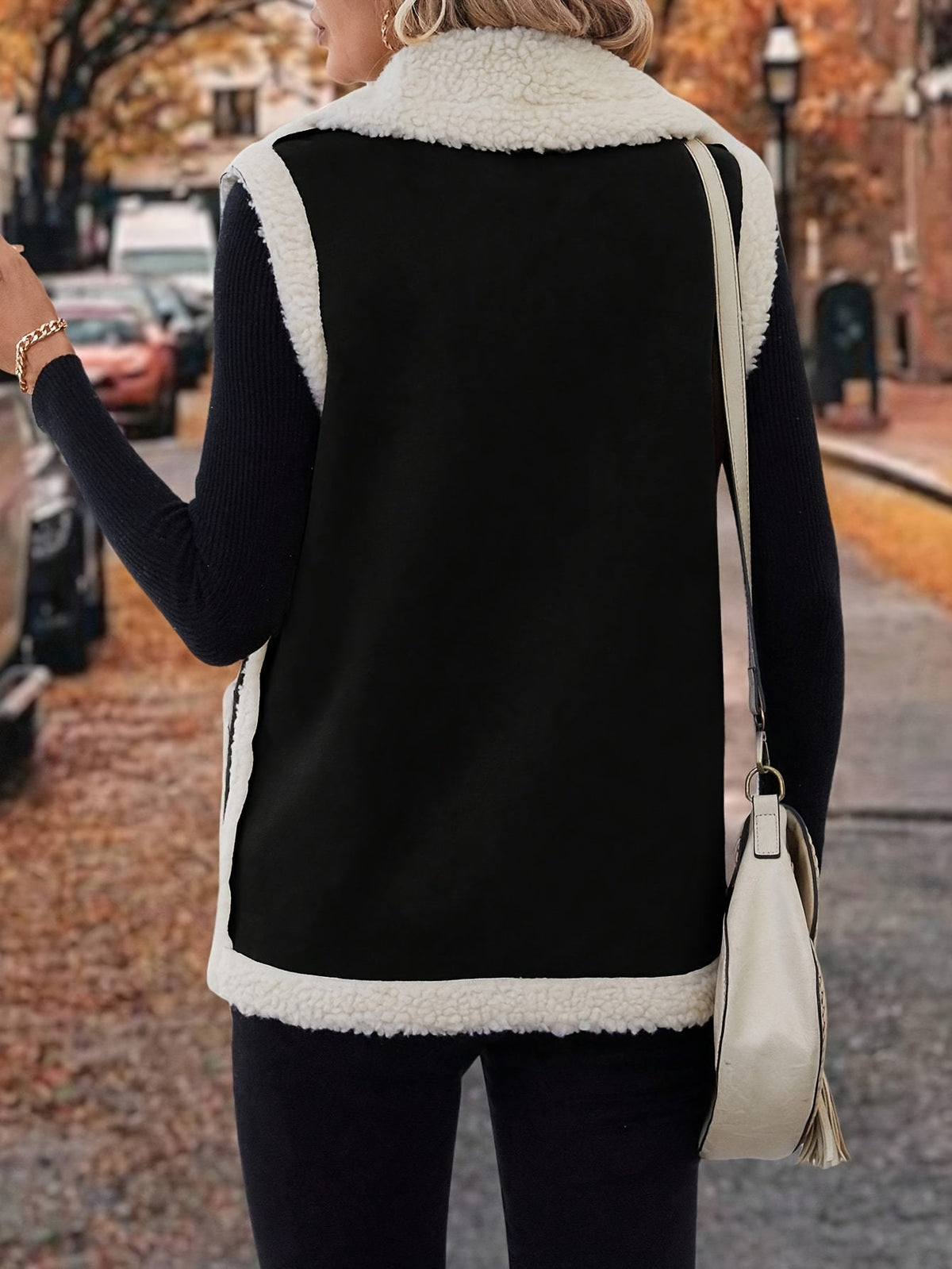 Women's rust sherpa lapel vest with open front and pockets