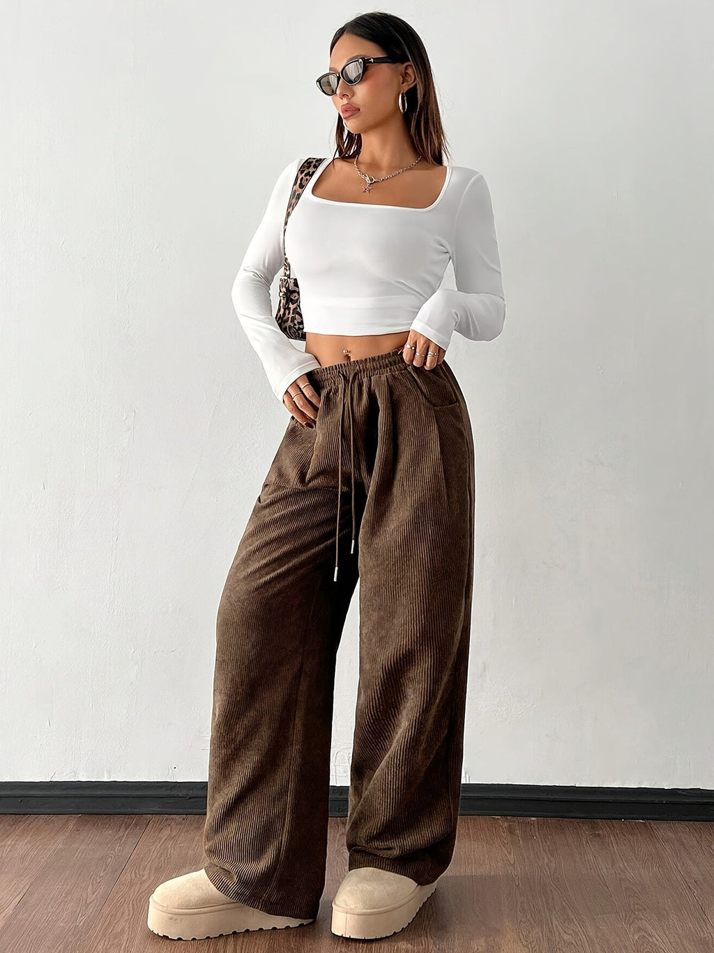 Women's dark brown wide-leg pants with an adjustable drawstring waist