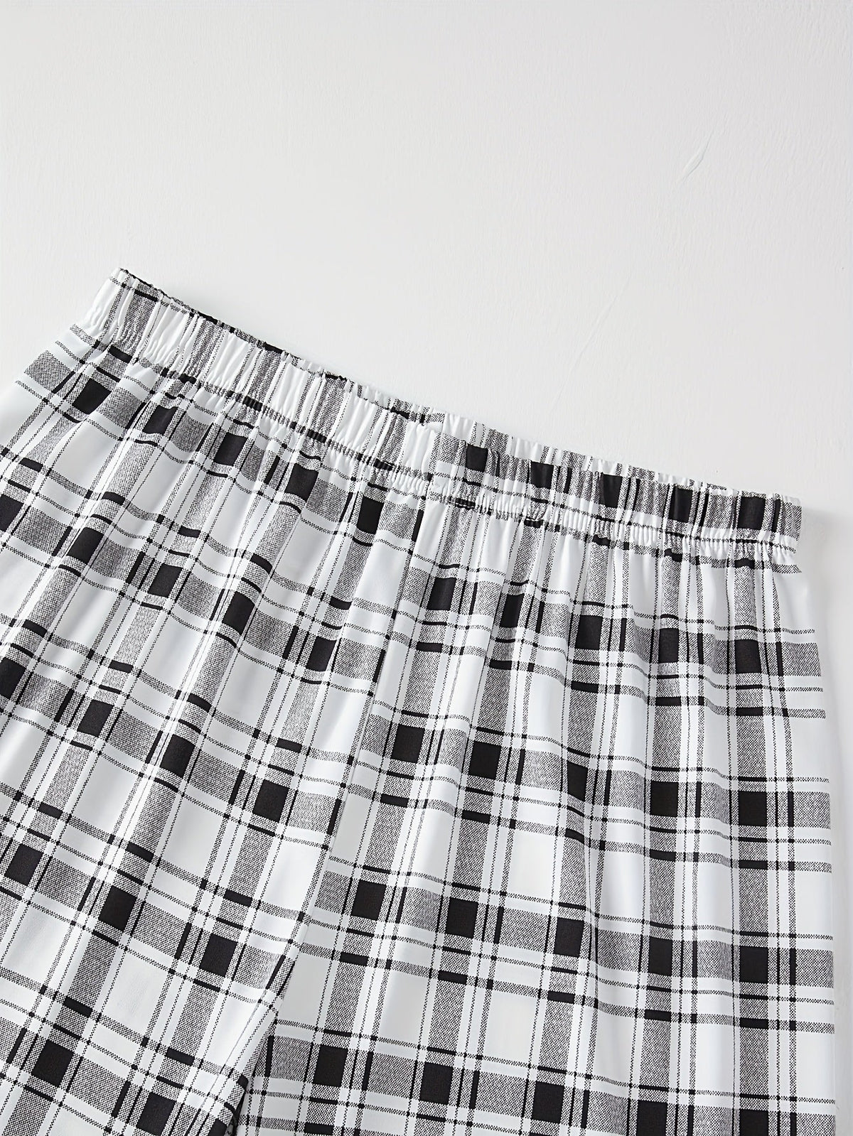 Men's light grey checkered two-piece pajama set with pocket tee