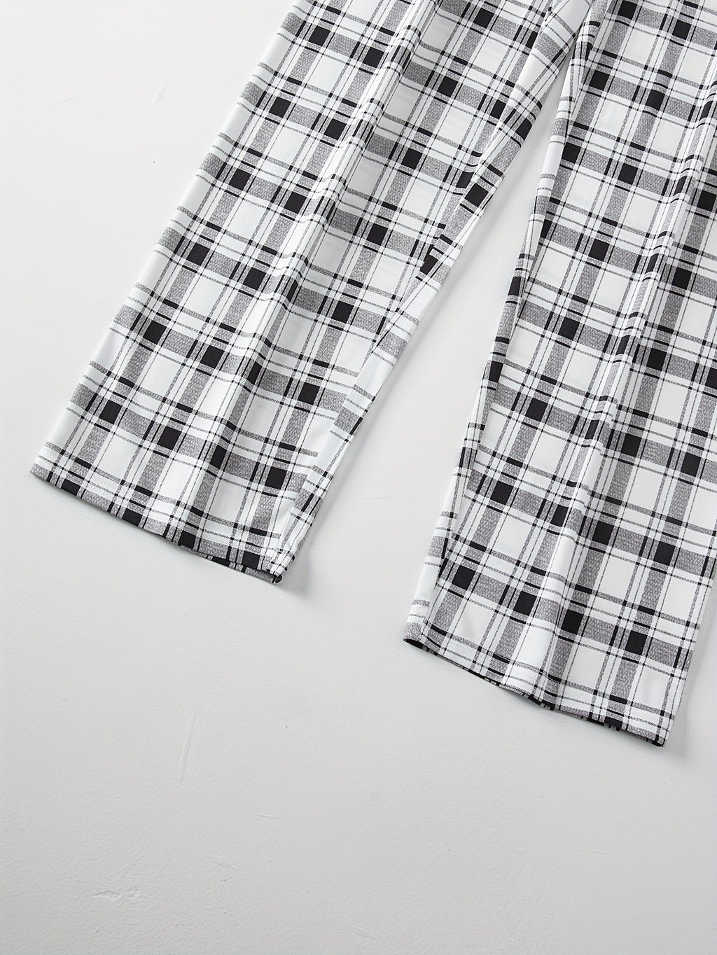 Men's light grey checkered two-piece pajama set with pocket tee